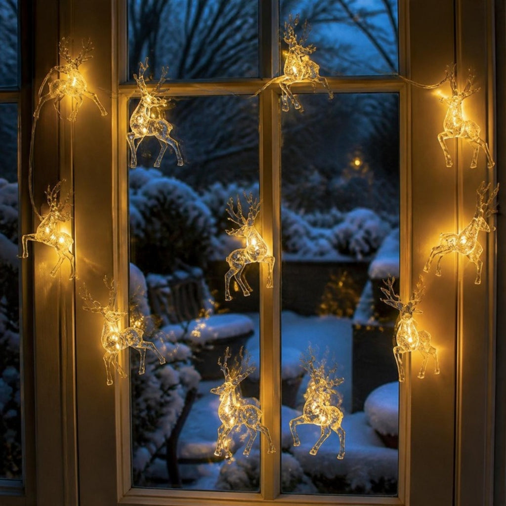 Reindeer light chain glowing in a window - APA Pure Living