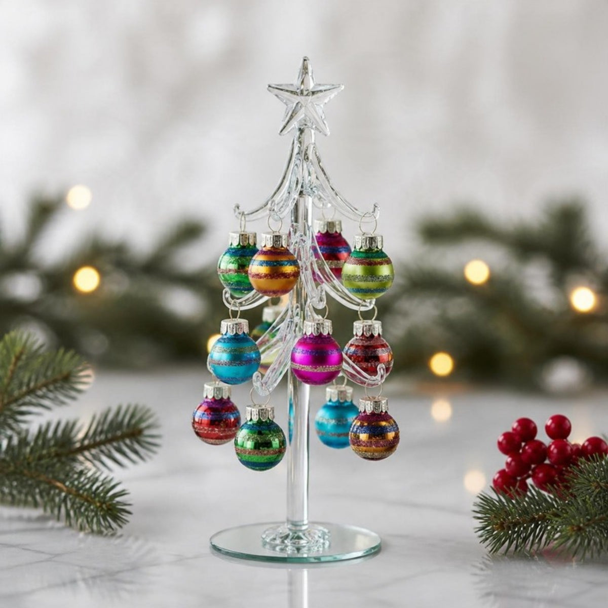 Glass Christmas tree ornament close-up with pine sprigs - APA Pure Living