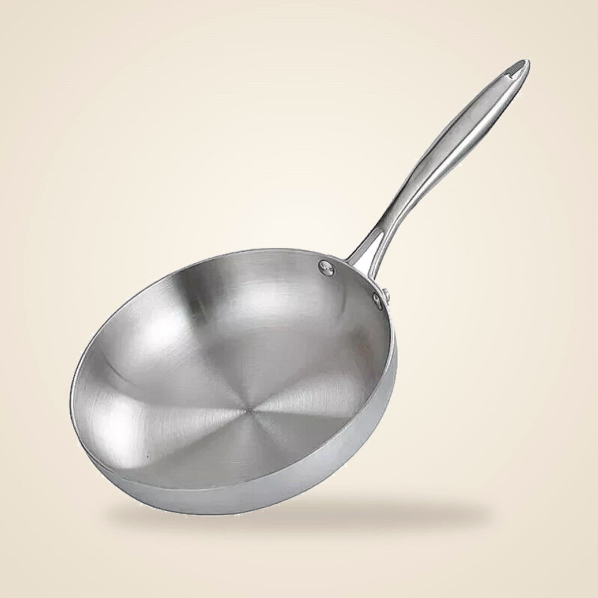 28 cm uncoated 304 stainless steel frying pan on a cream background
