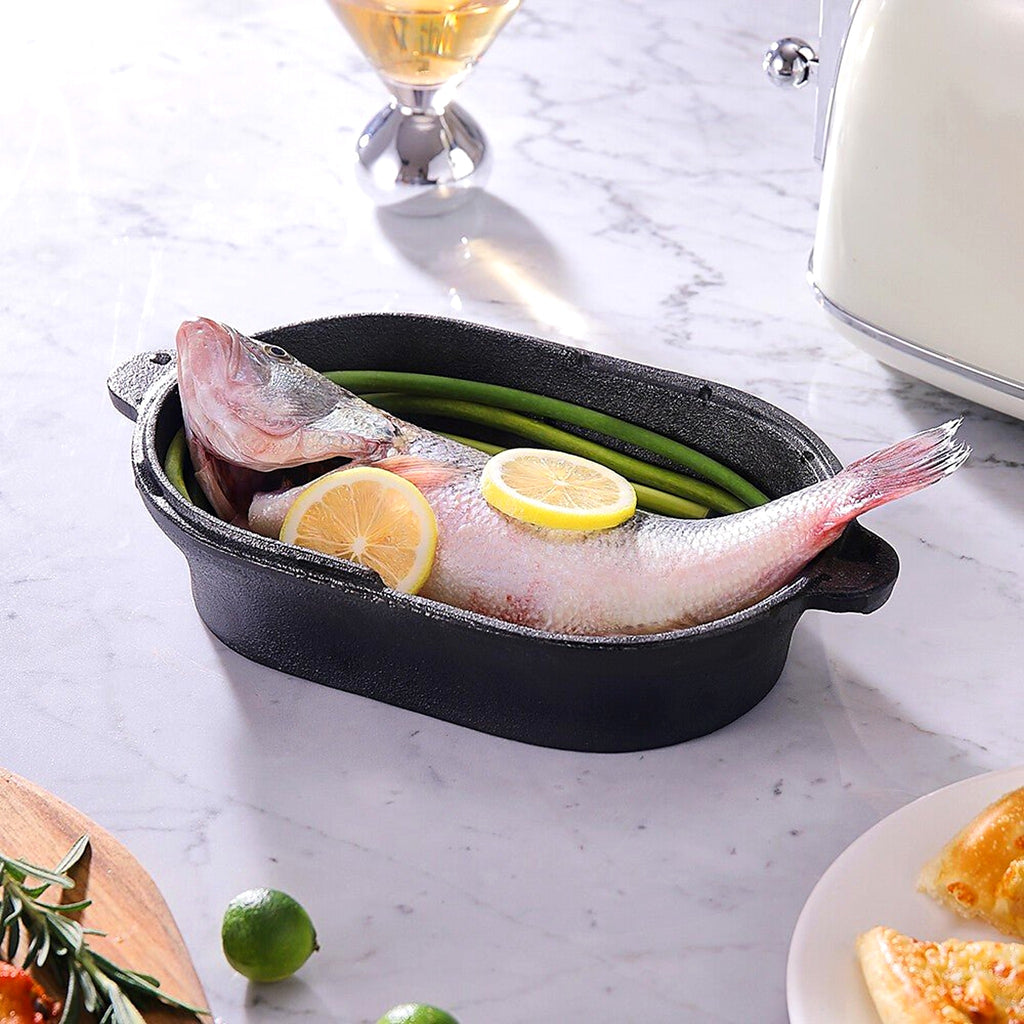 Whole fish with lemon in the oval cast iron Dutch oven