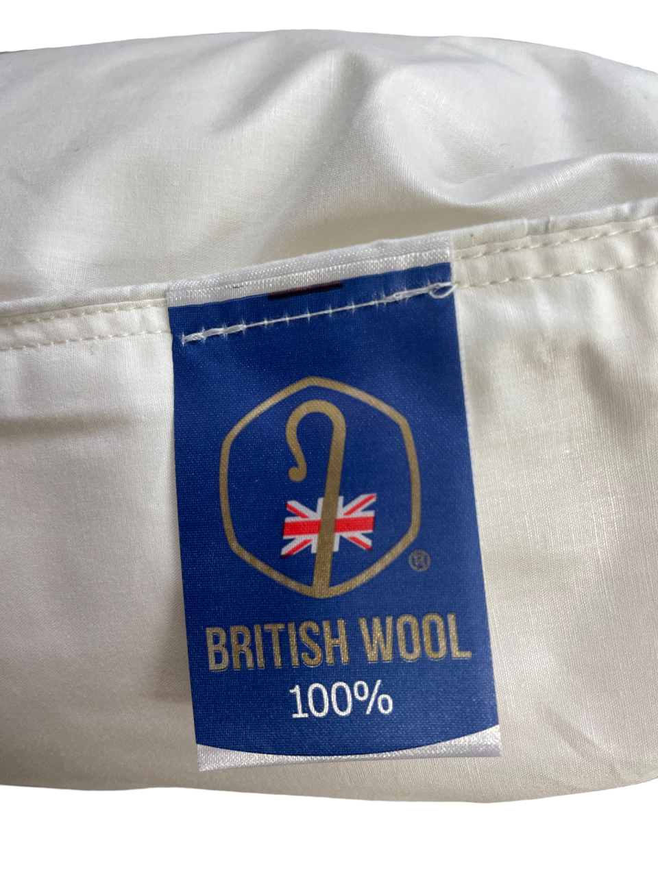 British Wool 100% label stitched onto the pillow cover
