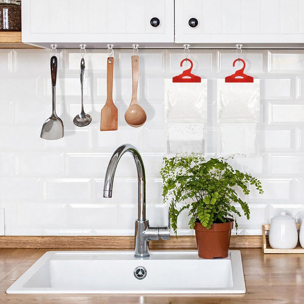 Moisture absorber bags hanging in a kitchen