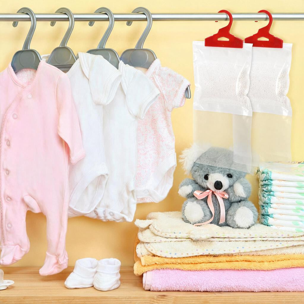 Moisture absorber bags hanging on a clothes rail