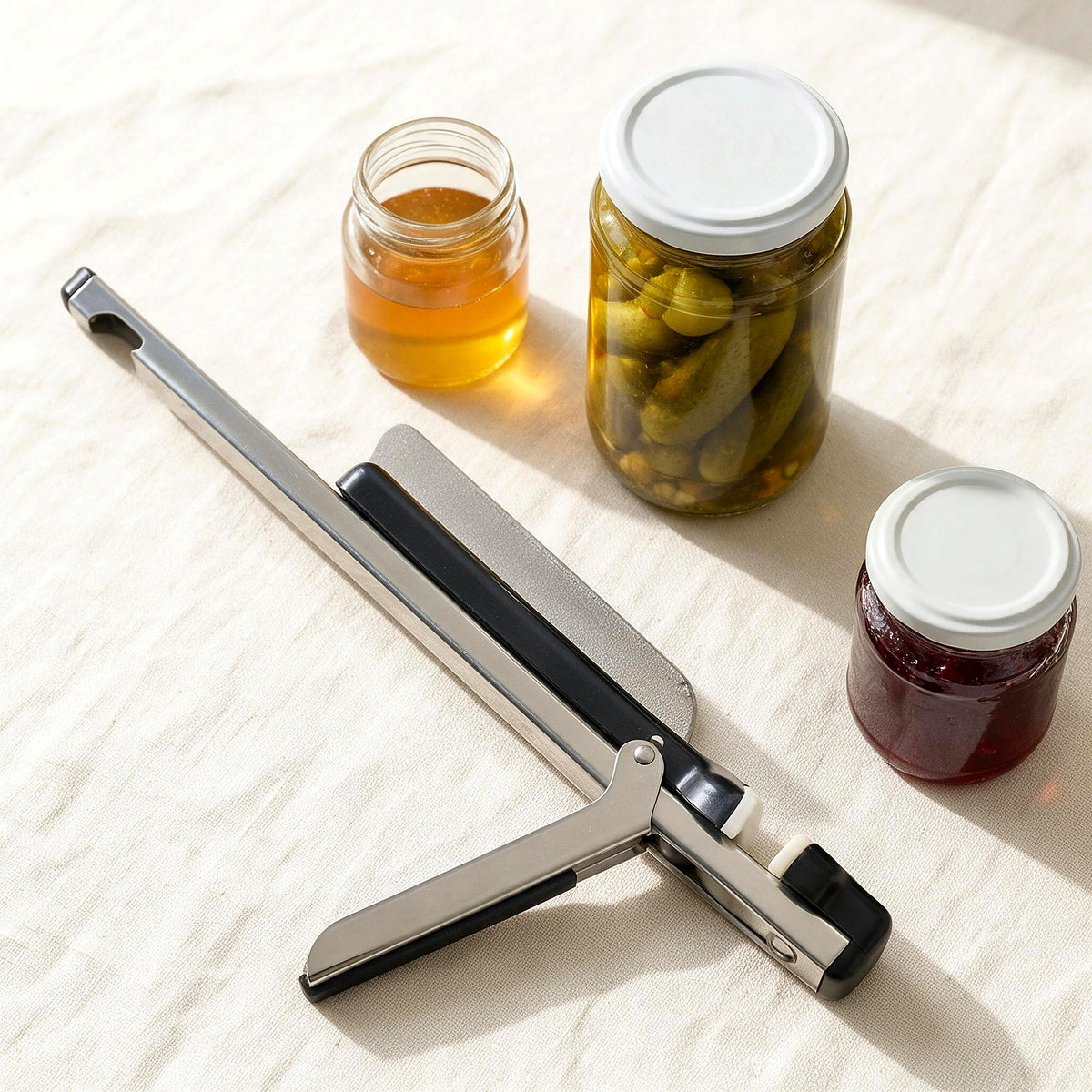 Stainless steel jar opener with jars of different sizes