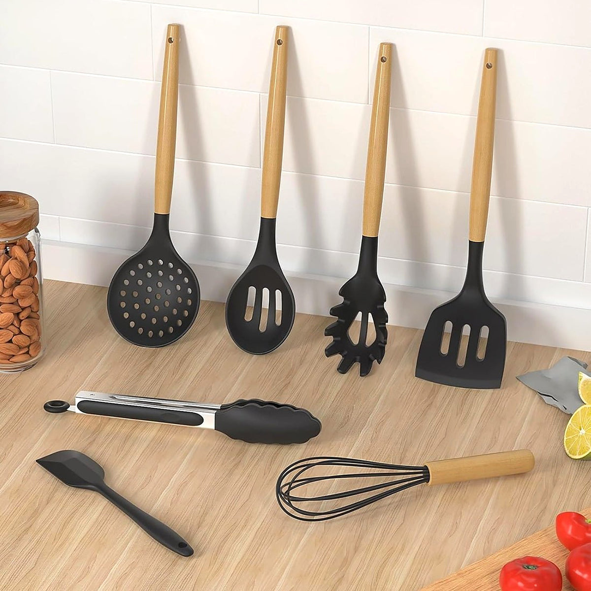 Silicone utensils with wooden handles on a kitchen counter