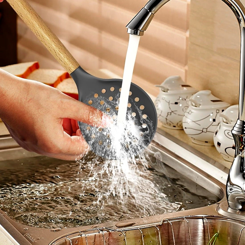 Rinsing a silicone utensil under the tap