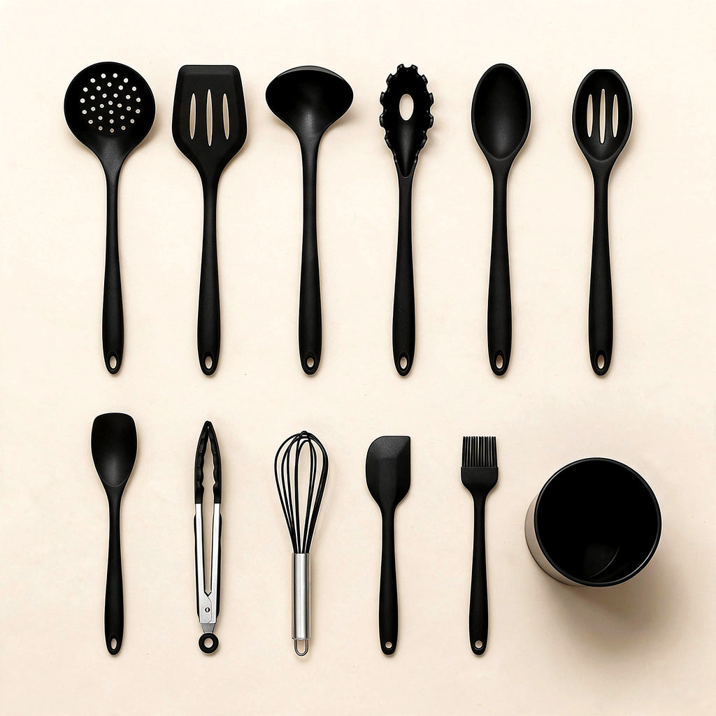 12-piece black silicone utensil set flat lay on cream