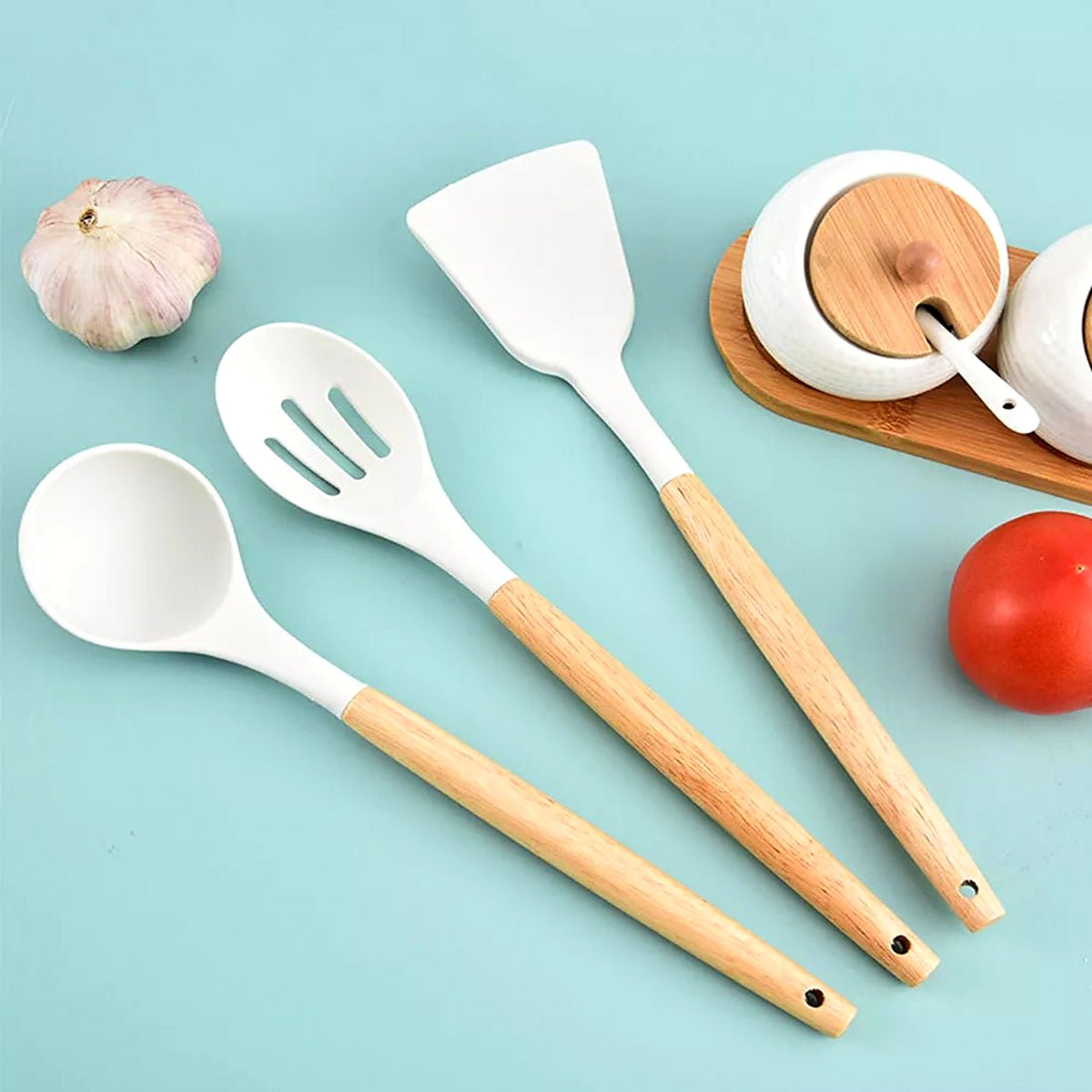 White silicone ladle, slotted spoon and turner