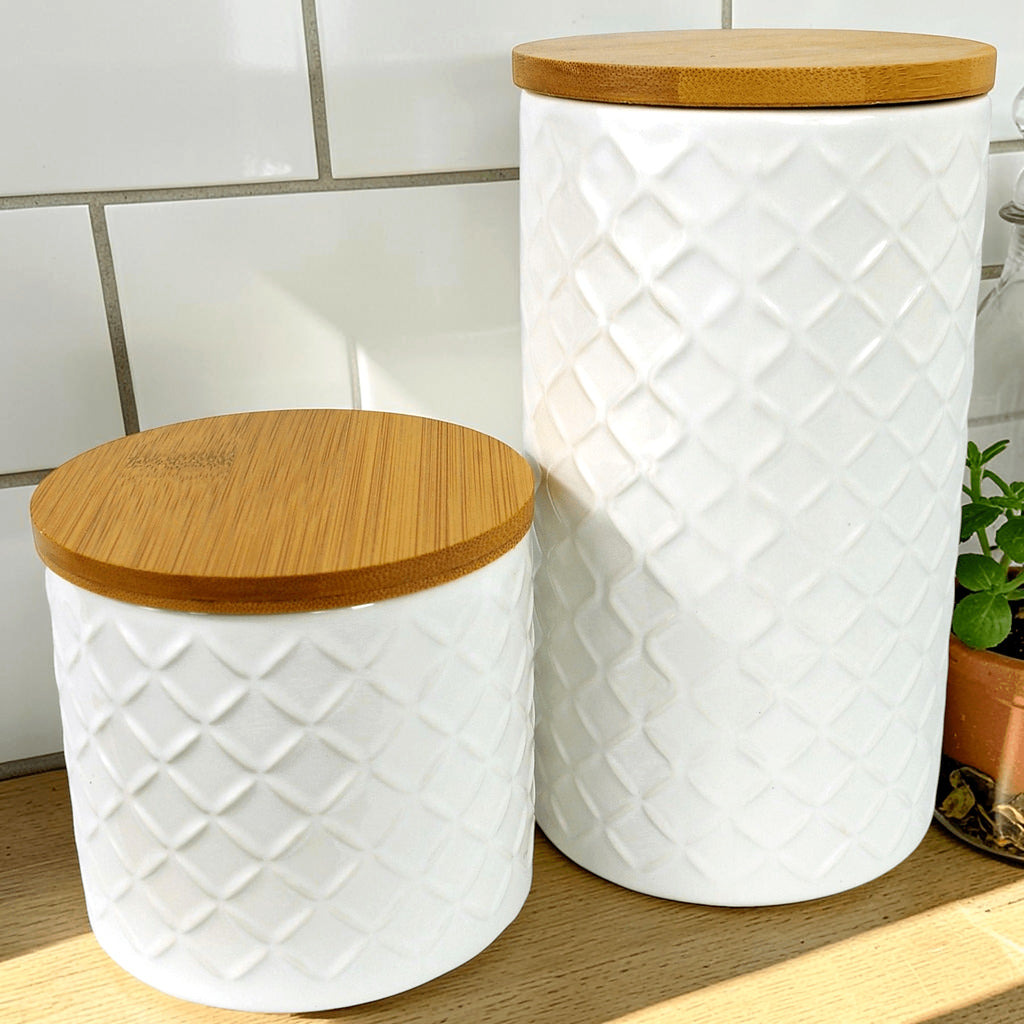 Cream embossed ceramic storage jars with bamboo lids