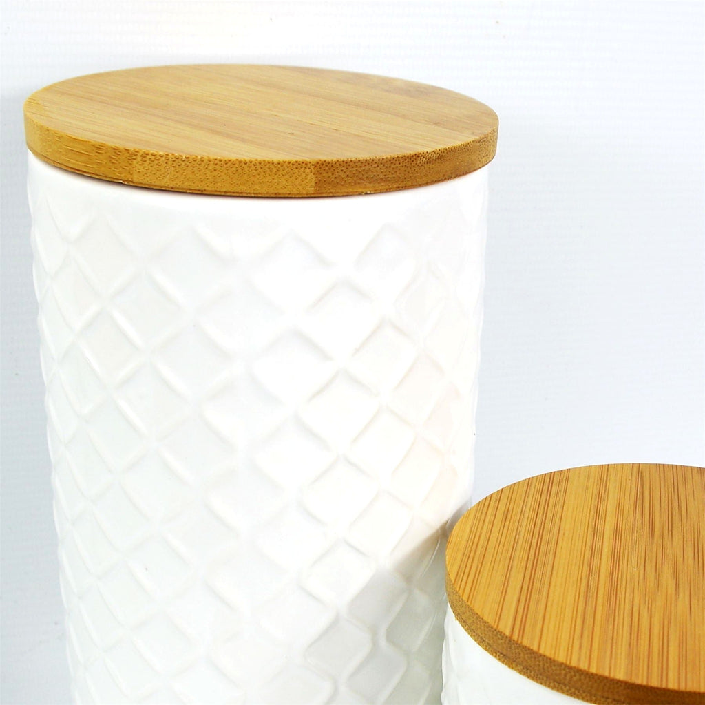 Tall cream embossed ceramic jar
