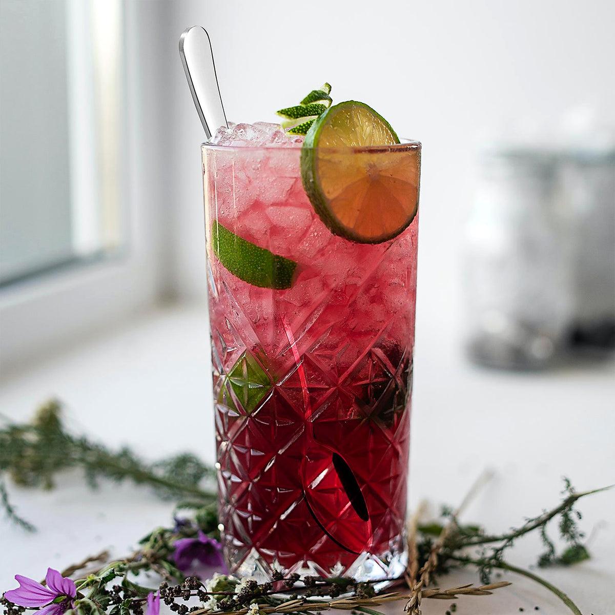 Long spoon in a tall iced drink