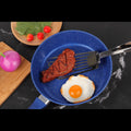 Flexible slotted turner frying steak and egg