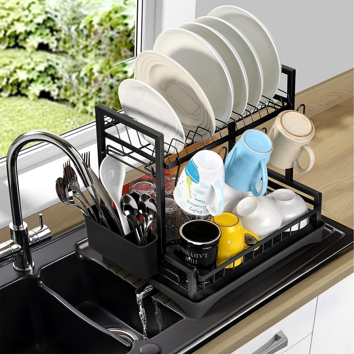 2-tier black dish drainer next to the kitchen sink