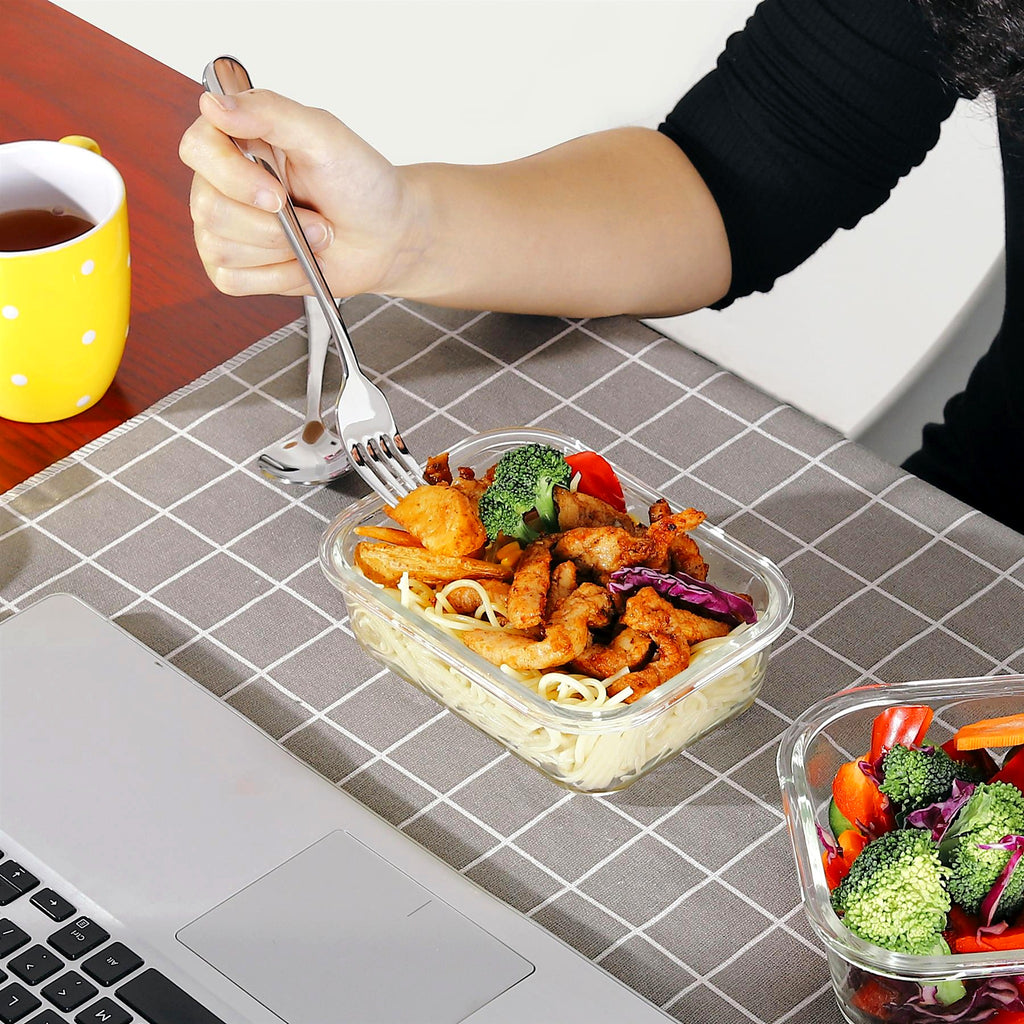Glass container with a packed lunch at the table