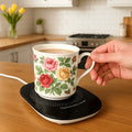 Mug warmer keeping a cup of tea warm