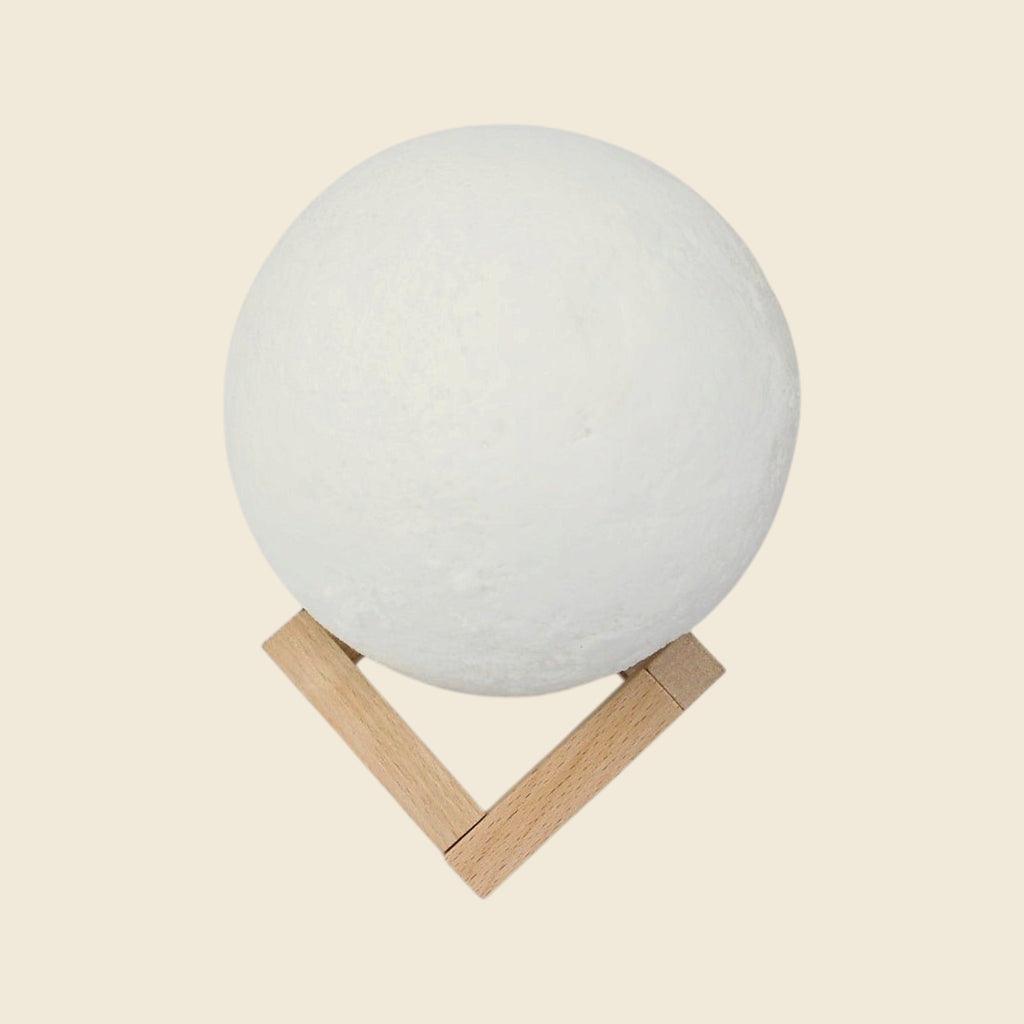 Moon lamp on wooden stand, switched off