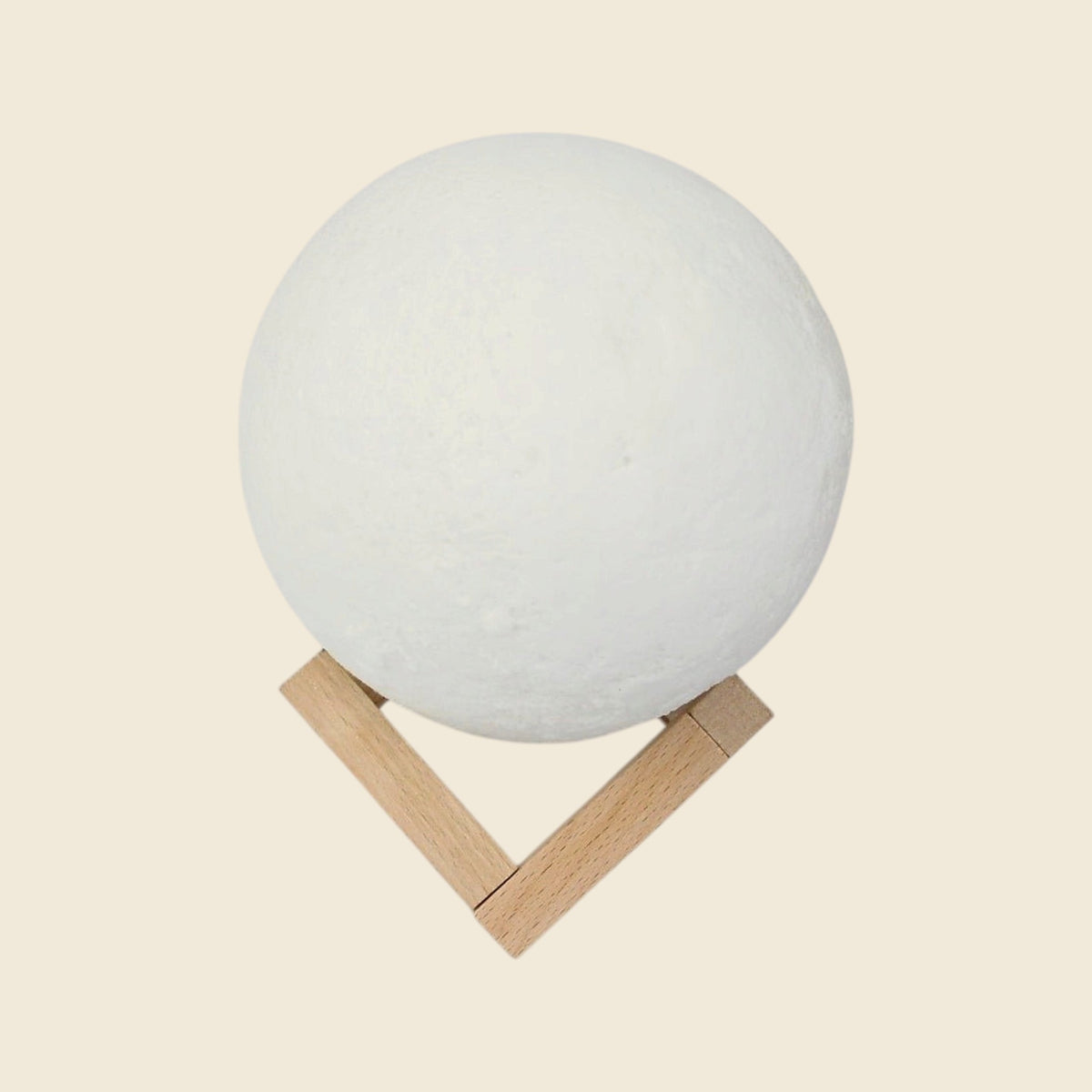 Moon lamp on wooden stand, switched off