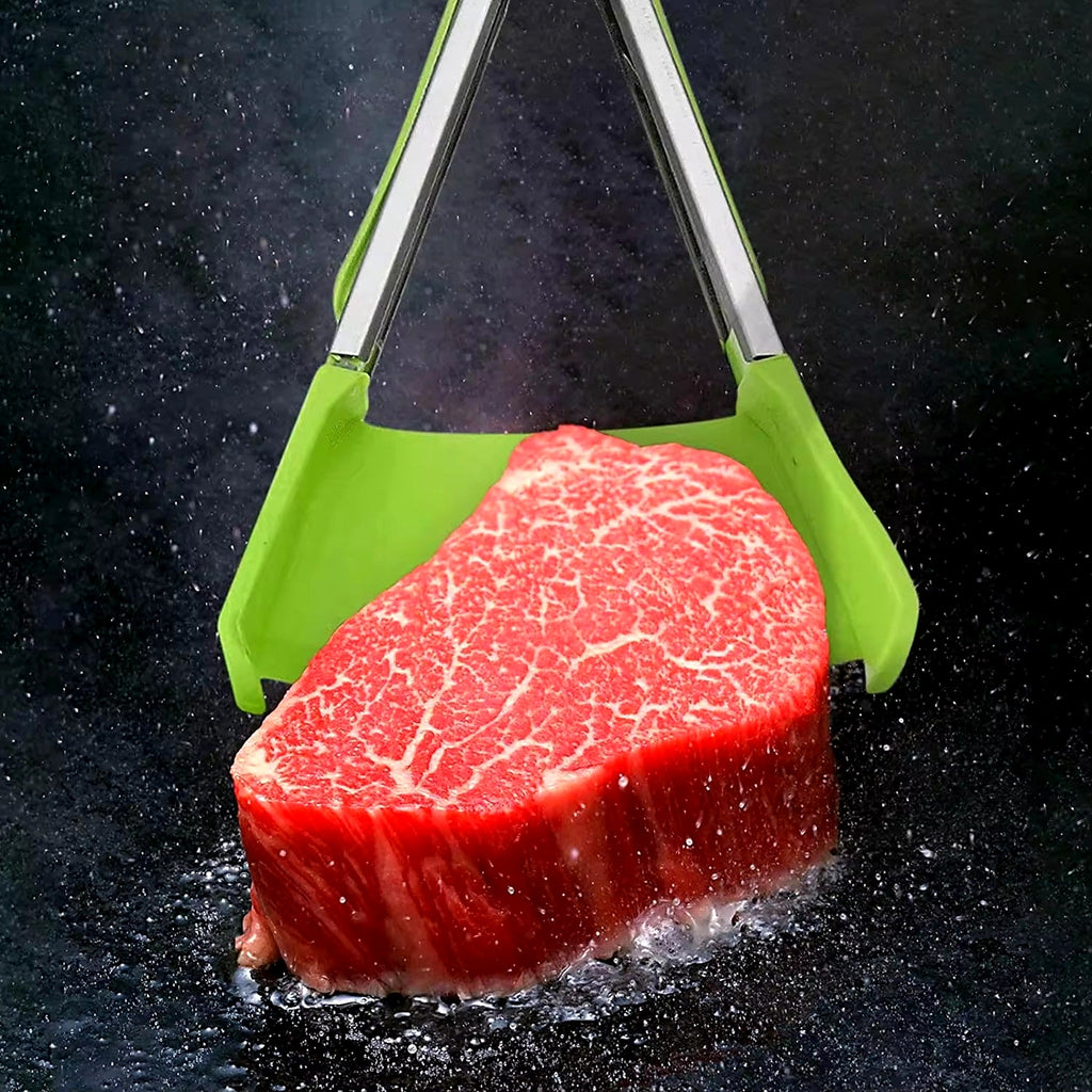 Silicone spatula tongs holding a steak