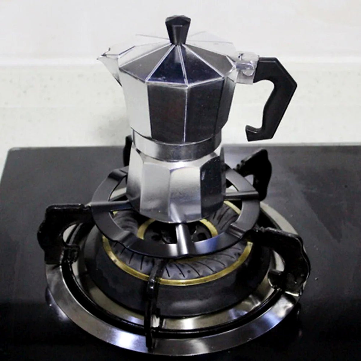 Moka pot standing steady on the gas ring reducer