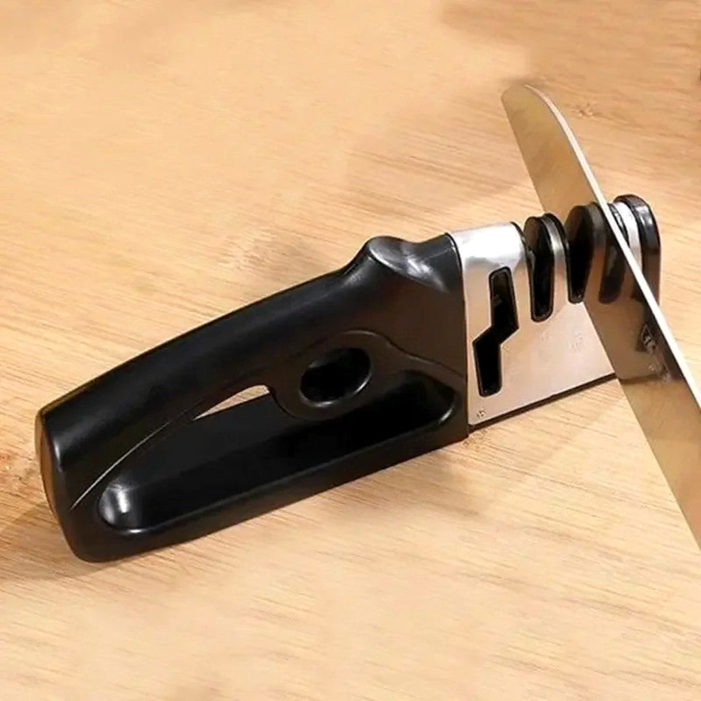 Knife and scissor sharpener on a wooden board