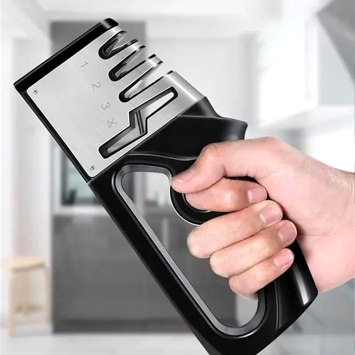 Hand holding the 4-in-1 knife sharpener