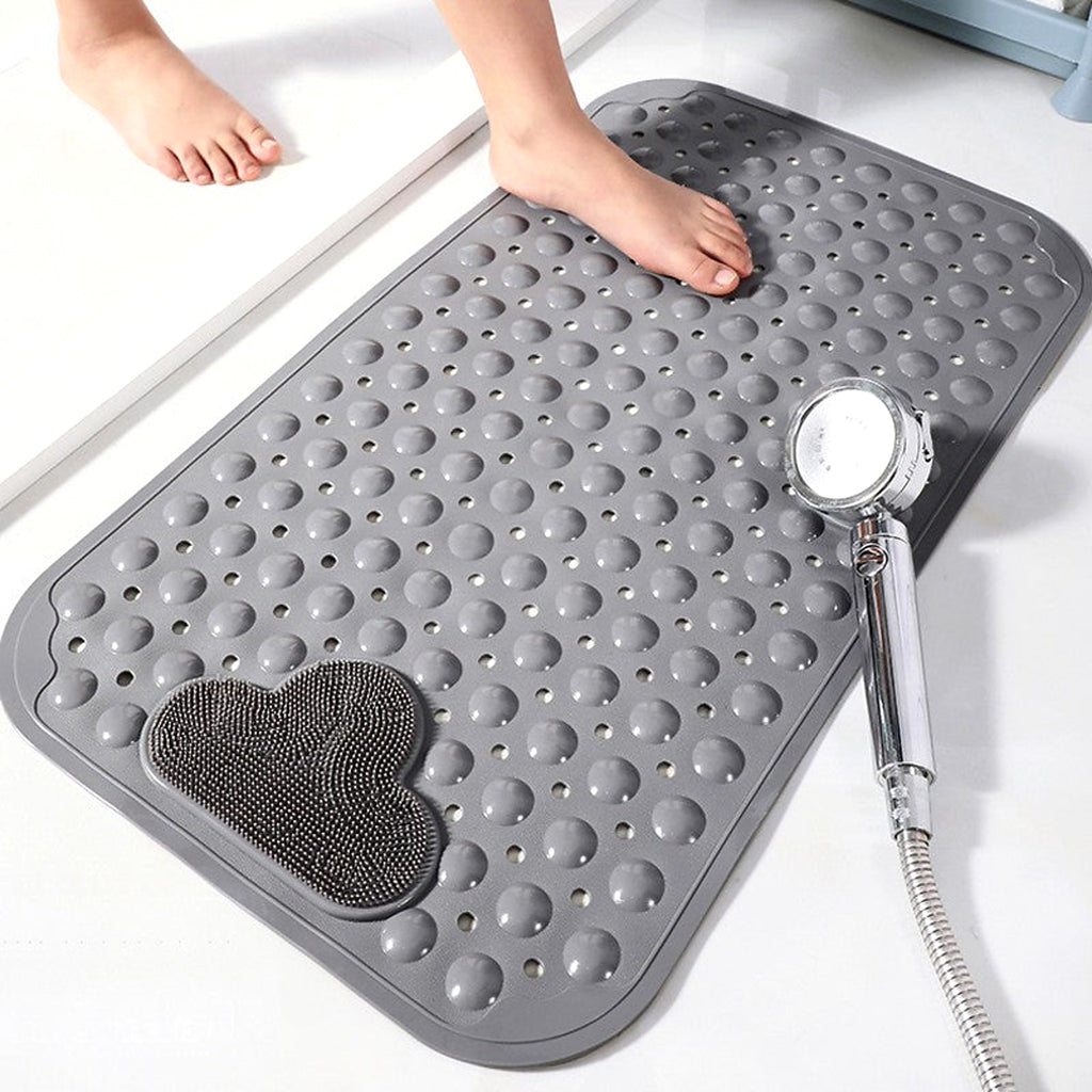 Standing on the non-slip bath mat
