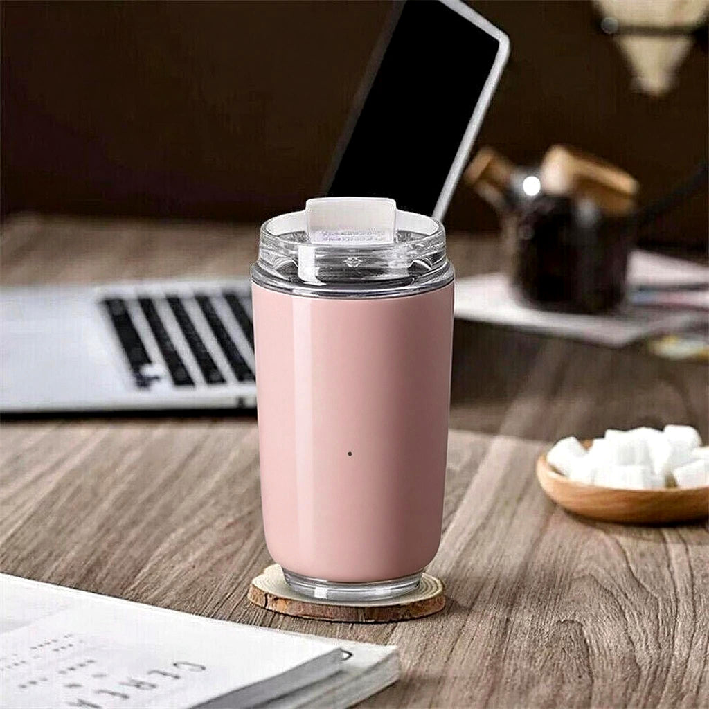 Pink travel mug on a home office desk