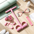 5-piece home workout set laid out beside a yoga mat
