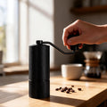 Grinding coffee beans with the manual coffee grinder