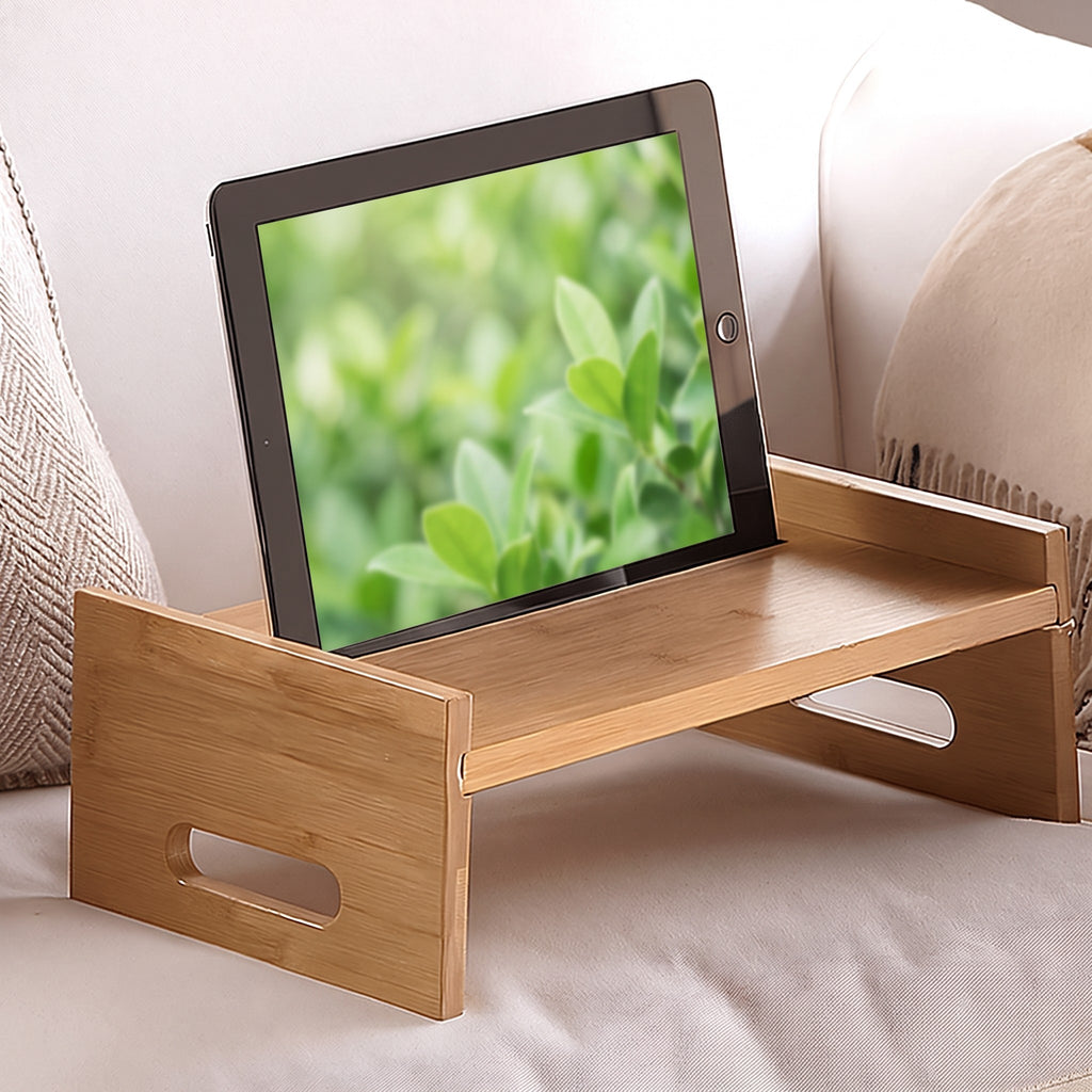 Bamboo tray holding a tablet on the bed